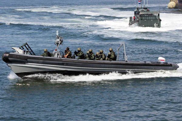 DEN HELDER, THE NETHERLANDS - JULY 7: Dutch Swat team in a speedboat during an assault demo at the Dutch Navy Days on July 7, 2012 in Den Helder, The Netherlands