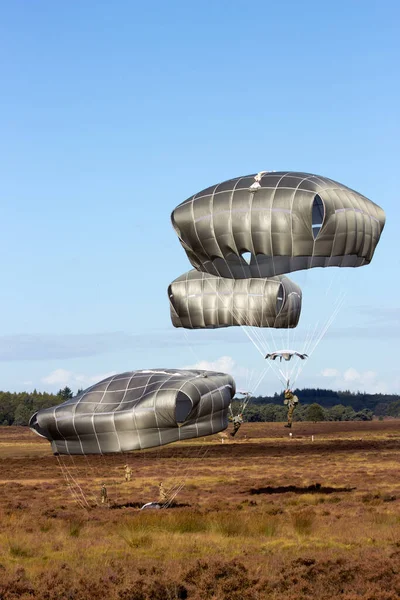 GINKELSE HEIDE, THE NETHERLANDS - SEP 22: Para troopers land on Dutch soil during the Operation Market Garden memorial on Sep 22, 2012 near Ede, The Netherlands. Market Garden was a large Allied military operation in September 1944