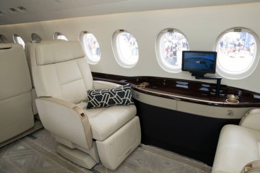 PARIS, FRANCE - JUN 23, 2017: Modern interior business jet Dassault Falcon 2000LX at the Paris Air Show 2017. clipart