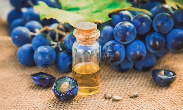 grape seed extract in a small jar. Selective focus.