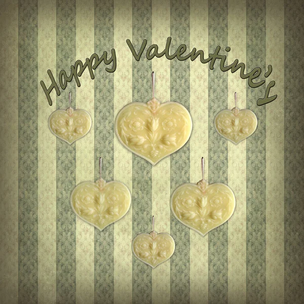 happy Valentine\'s day, cute wax hearts hang on a faded and romantic Victorian wallpaper