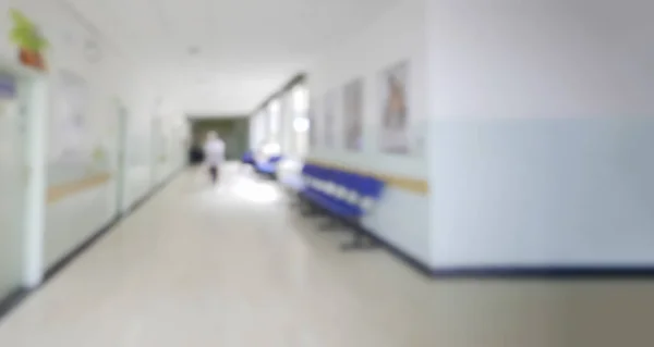 Blurred unfocused view of interior hallway and waiting room of children hospital - Out of focus blur shot background backdrop of medical institution interior - Indoor hospital building — Stock Photo, Image