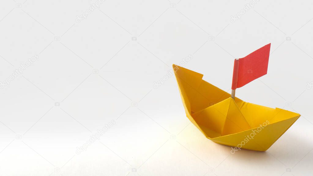 Origami Crane in hand isolated on white background. Close up