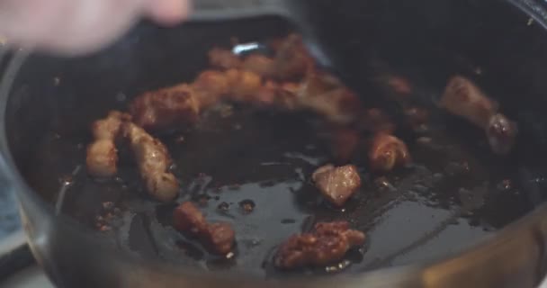 Bacon slices frying on pan closeup — Stock Footage Bacon slices frying on pan closeup Stock Footage