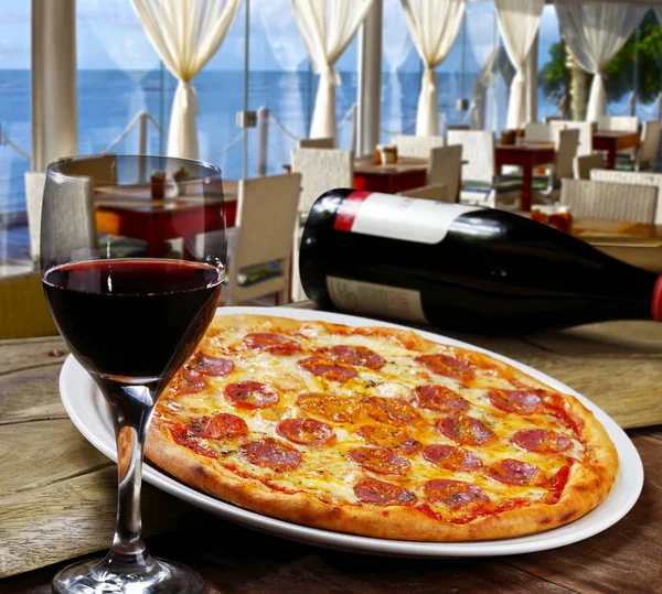 Pepperoni pizza and red wine