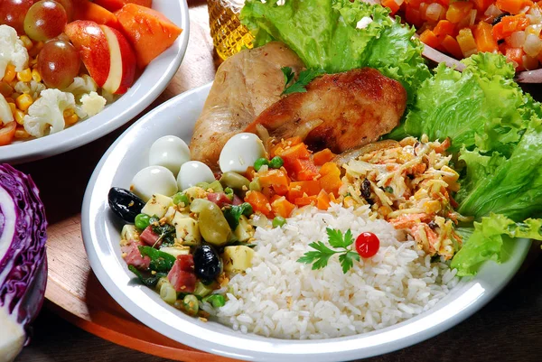 Food Dish with Rice Chicken and Salad Steak