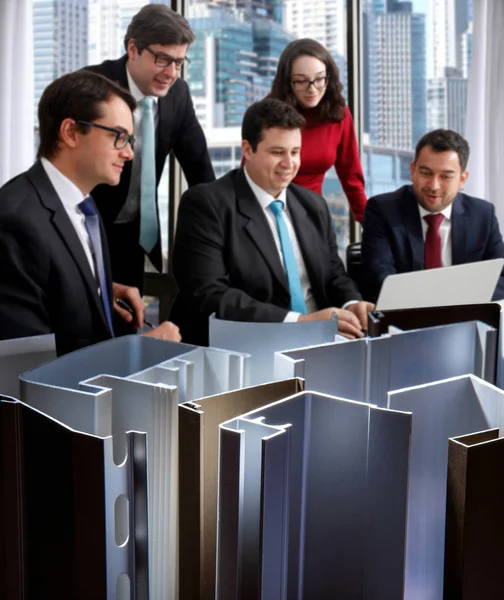 Architects and executives in meeting, building construction using aluminum