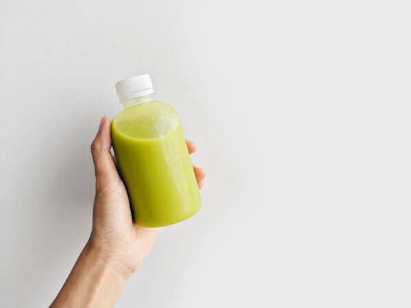 Hand Holding Fresh Healthy Avocado Juice Bottle Isolated White Background — Stock Photo, Image