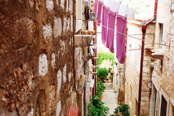 Famous narrow alley of Dubrovnik old town in Croatia - Prominent travel destination of Croatia.