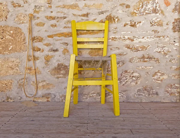 Yellow Chair Stone Wall Background — Stock Photo, Image