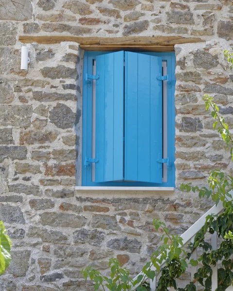 Vibrant Blue Shutters Window Stone Wall — Stock Photo, Image