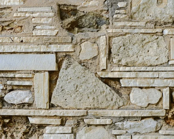 Ungewöhnliche Zufällige Formen Steinmauer Nahaufnahme — Stockfoto