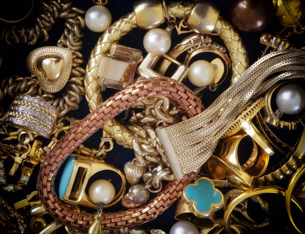 Glowing Golden Jewelery Closeup Top View Stock Photo