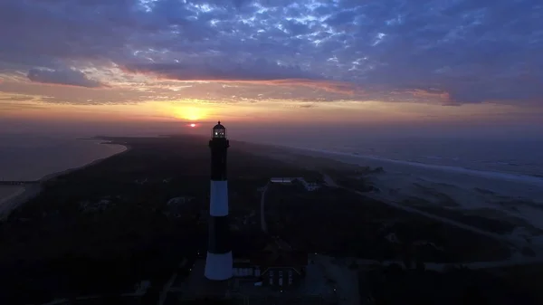 Aerial View of Sunrise at lighthouse on Long Island on a Spring Morning by a Drone