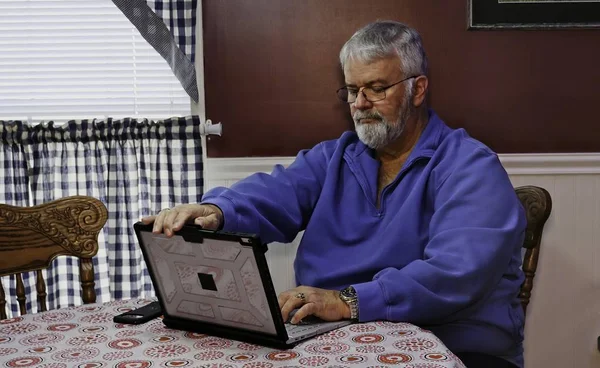 Senior Happy Using a Computer and Technology