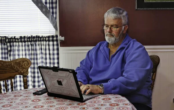 Senior Happy Using a Computer and Technology