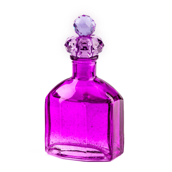 Purple vintage perfume bottle isolated on white background.