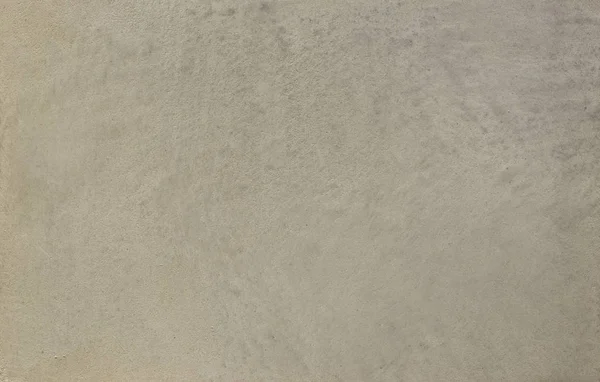 Foto einer alten grauen Zementwand mit Brüchen. — Stockfoto