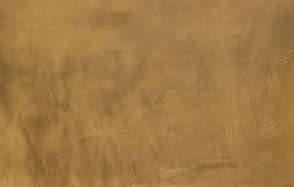 Foto einer alten goldenen Zementwand mit Brüchen. Textur für Muster. — Stockfoto