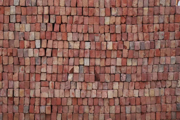Antique brick walls of Hindu temples. Rectangular bricks, cut from red sandstone and bonded together with lime mortar.
