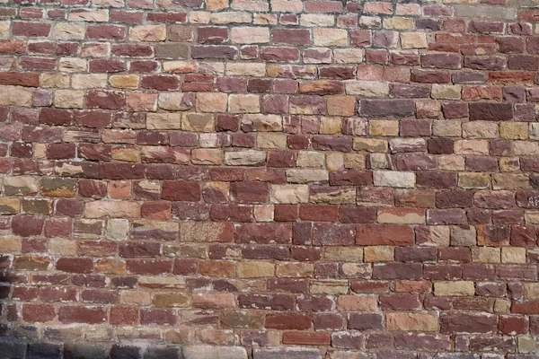 Antique brick walls of Hindu temples. Rectangular bricks, cut from red sandstone and bonded together with lime mortar.