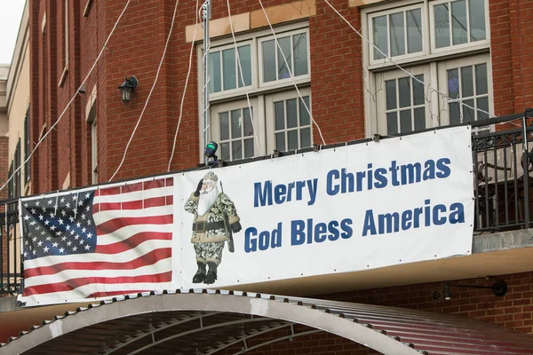 Building Banner Features Santa Wearing Camouflage And Carrying Rifle — Stock Photo, Image
