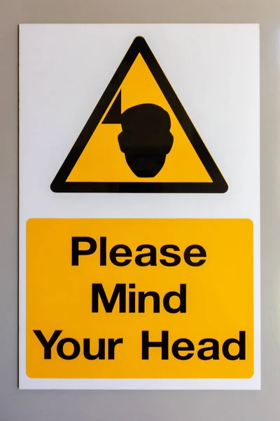 Proszę pamiętać Twój głowa znak ostrzegawczy — Zdjęcie stockowe
