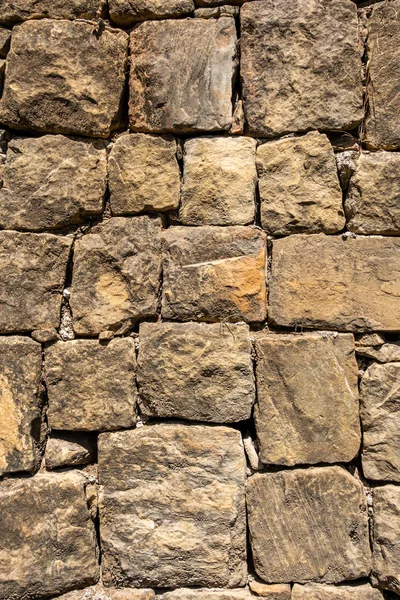 Stone block built wall