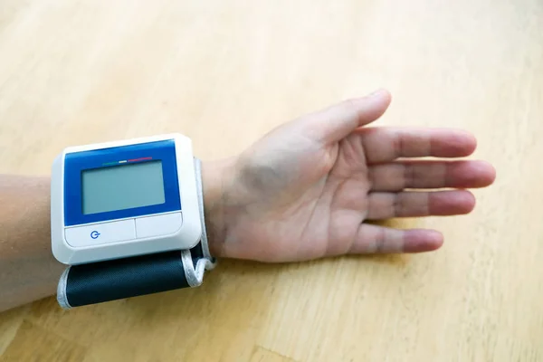 Device for measuring blood pressure. On the hand prior to measurement.
