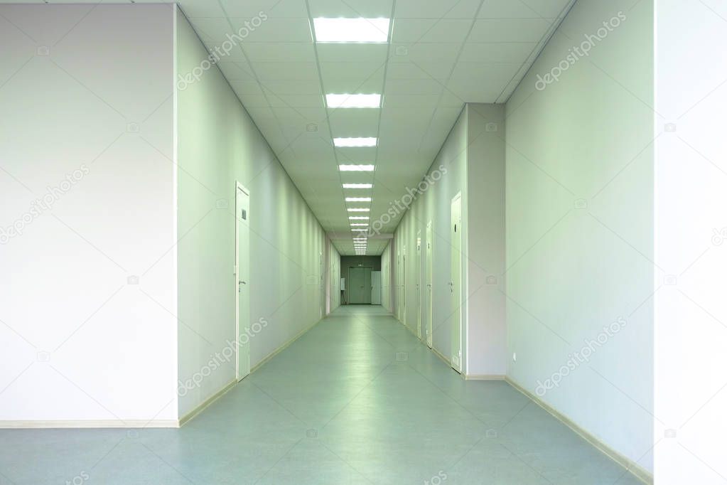 Medical clinic. A long corridor with offices for doctors. Before taking patients.