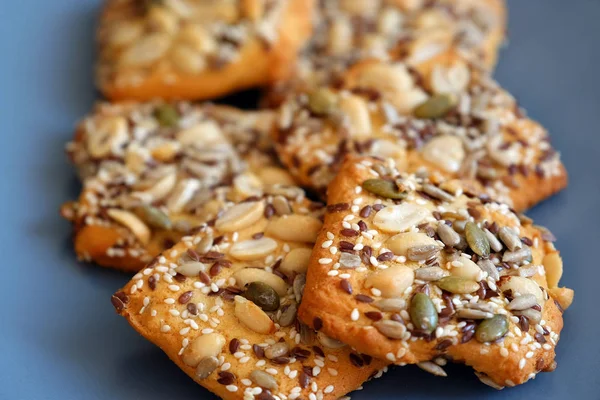 Oatmeal cookies with grain and fiber and nuts. Cookies with nut grains. On a grey platter.