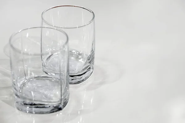 two empty glasses. close-up view from above. the empty surface of the table.