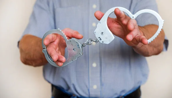 Man Holds Handcuffs His Outstretched Hand Close — Stock Photo, Image