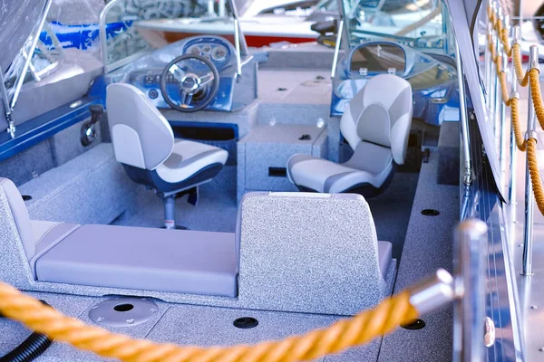 The cabin of the boat with an easy chair. Boat cabin with all navigation equipment