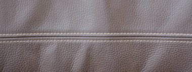 cilt yapısı. kahverengi deri doku. büyük gözenekleri. iki paralel dikişleri