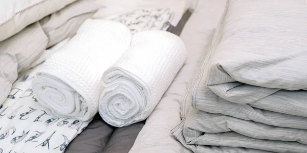 Bed linen and towels at the hotel. Clean towel on bed in modern interior bedroom.