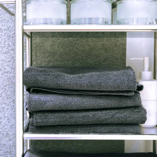 Clean Colored towels hanging on the rack in the bathroom. Focus on the top of the hook and towels — Stock Photo, Image