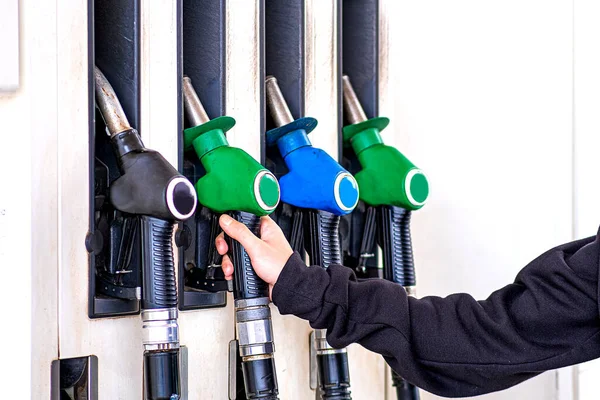 Gas station gun in the tank of the car. I need to fill up the gas tank. — Stock Photo, Image