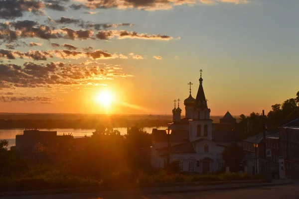 Christian church on the banks of the Volga River at dawn. Nizhny Novgorod