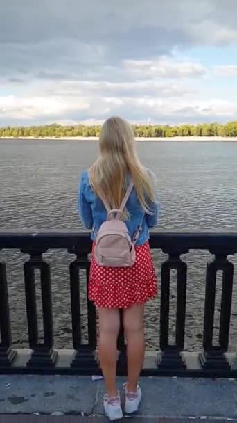 Blonde Long Straight Hair Red Dress Medium Length Backpack Stands — Stock Video