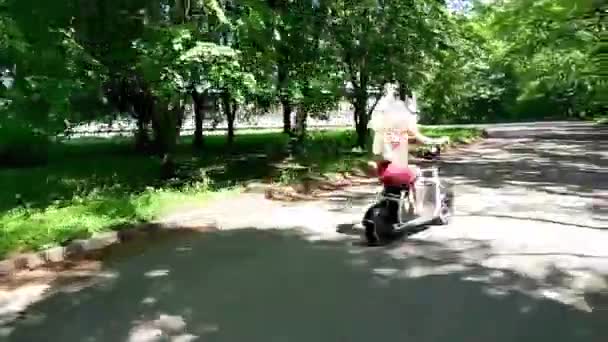 Handsome Young Blonde Woman Red Dress Backpack Smiling While Riding — Stock Video