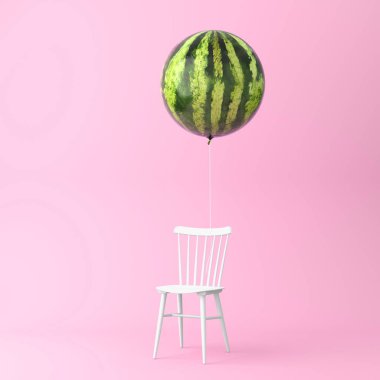 Pastel pembe bir arka plan üzerinde sandalye konsepti ile balon karpuz. en az fikir gıda ve meyve kavramı. İletişim ya da çizim tasarım pazarlama bir reklam içinde çalışma üretmek için bir fikir yaratıcı.