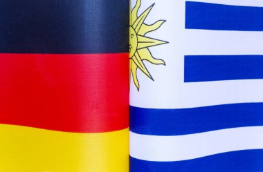 Almanya ve Uruguay 'ın ulusal bayrakları yakın plan politikası
