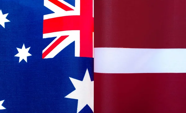澳大利亚和拉脱维亚国旗的碎片被关闭 — 图库照片