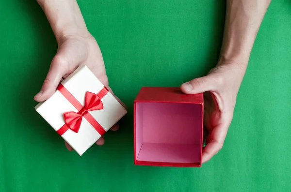 Present Gift Box Red Ribbon Male Hands Green Background — Stock Photo, Image