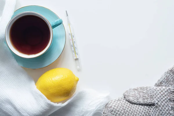 Cup Hot Tea Thermometer Lemon Scarf White Table Background — Stock Photo, Image