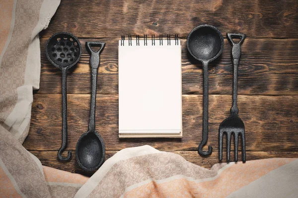 Food menu or product list mock up. Blank pages notepad on a wooden kitchen table background.