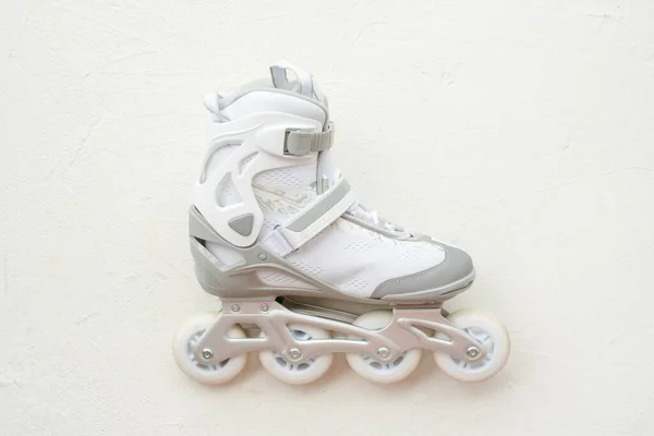 White roller skates on the white background.