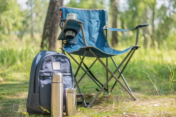 Backpack Vacuum Flask Touristic Chair Steel Cup Ground Green Forest Stock Photo