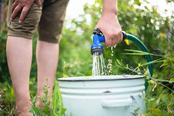 Gardener Fills Bucket Water Close — Stock Photo, Image